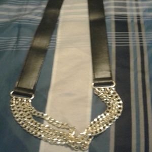 Belt snaps at the back, decorative  chain in fron